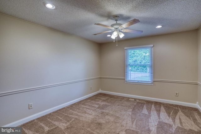 carpeted empty room with a ceiling fan, baseboards, a textured ceiling, and recessed lighting