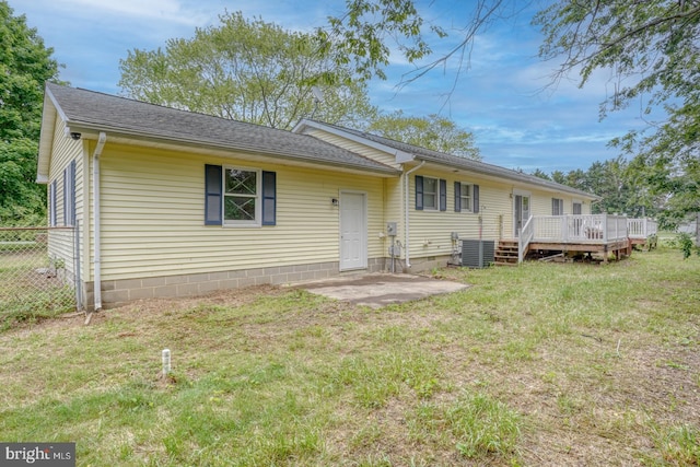 back of property featuring a deck, central AC, and a shingled roof