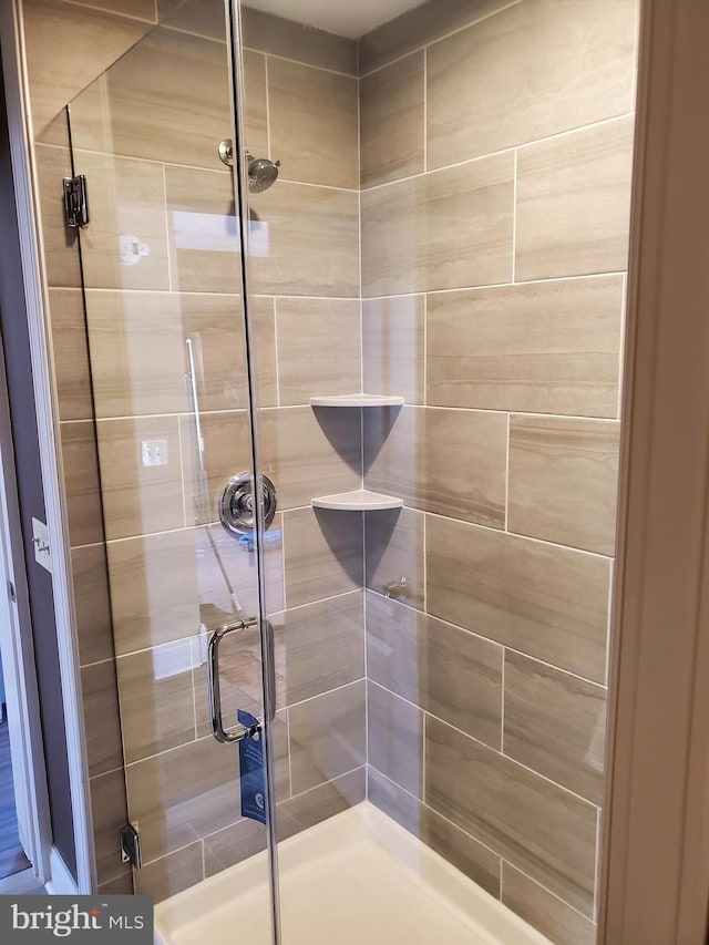 full bath featuring a shower stall