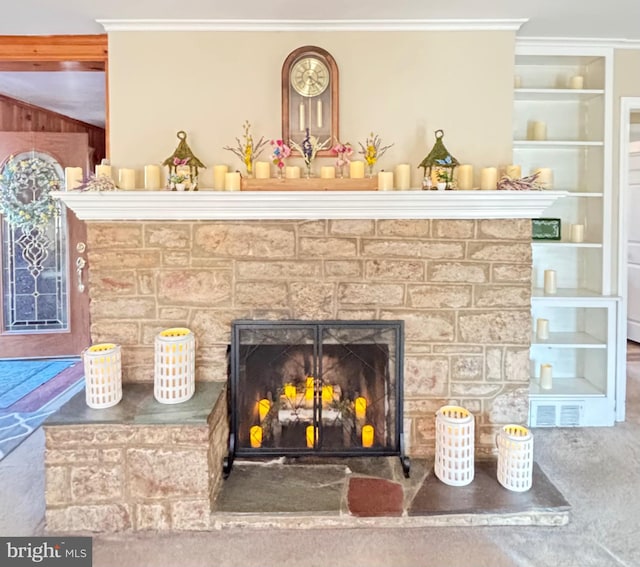 741 Bellevue Ave, Langhorne, PA 19047 - room details with visible vents, a fireplace with raised hearth, ornamental molding, and built in features