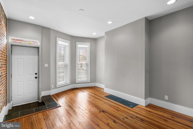 foyer entrance with recessed lighting, baseboards, and hardwood / wood-style floors