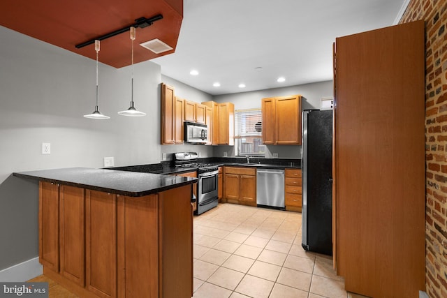 kitchen with stainless steel appliances, a peninsula, visible vents, and light tile patterned floors