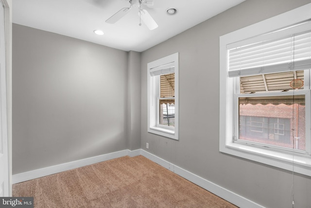 carpeted empty room with recessed lighting, baseboards, and a ceiling fan