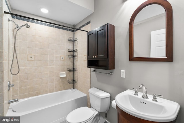 bathroom featuring a sink, toilet, and  shower combination