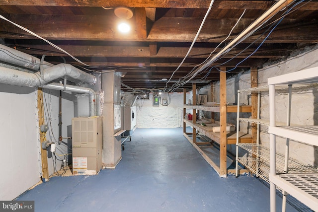 unfinished below grade area featuring washer / dryer