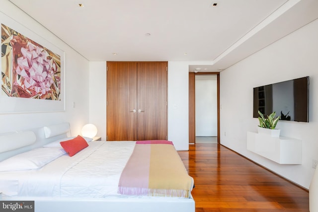 bedroom featuring wood finished floors