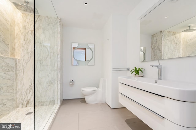 full bathroom featuring toilet, tile patterned flooring, vanity, and walk in shower