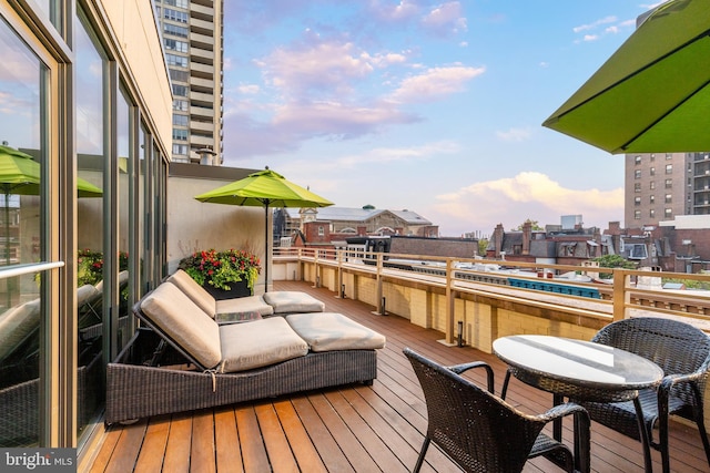 wooden terrace with a city view