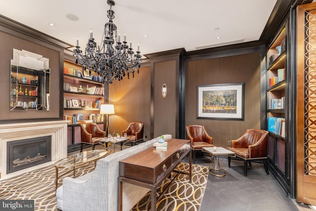 interior space with an inviting chandelier, ornamental molding, and built in features