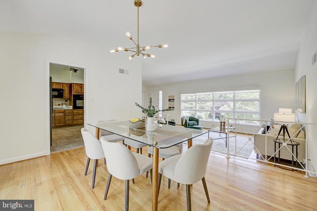 3217 Pauline Dr, Chevy Chase, MD 20815 - dining room featuring light wood-type flooring and a chandelier