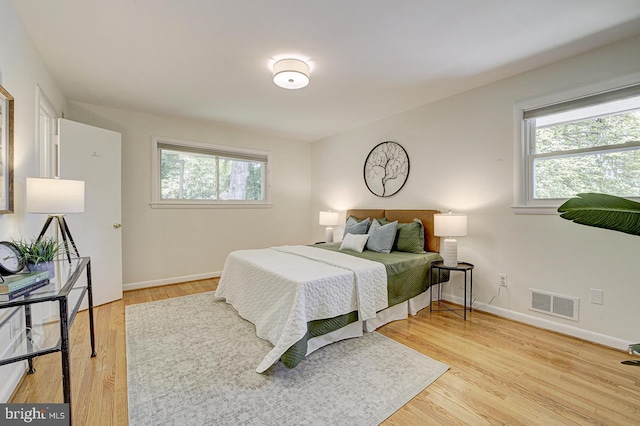 3217 Pauline Dr, Chevy Chase, MD 20815 - bedroom with multiple windows and light wood-style floors