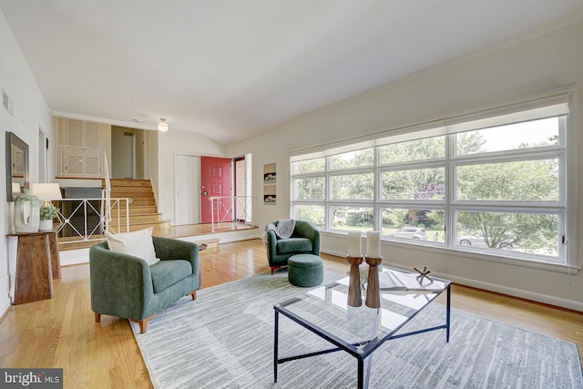 3217 Pauline Dr, Chevy Chase, MD 20815 - living area featuring stairway, light wood-style floors, and lofted ceiling