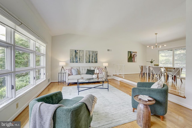 3217 Pauline Dr, Chevy Chase, MD 20815 - living area with plenty of natural light, a chandelier, light wood-style flooring, and lofted ceiling