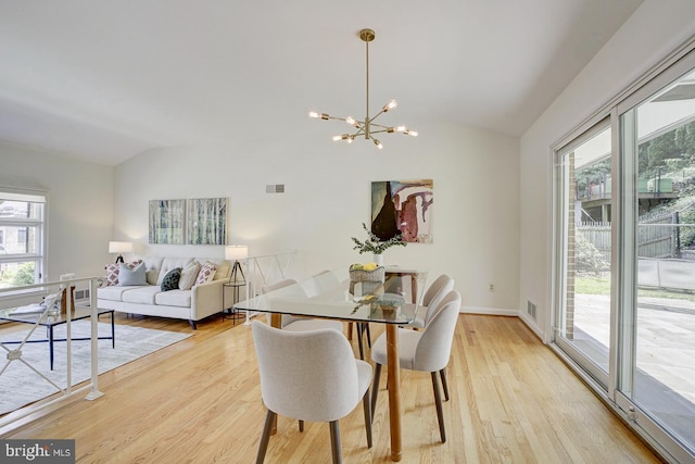 3217 Pauline Dr, Chevy Chase, MD 20815 - dining space with lofted ceiling, a chandelier, and light wood-style flooring