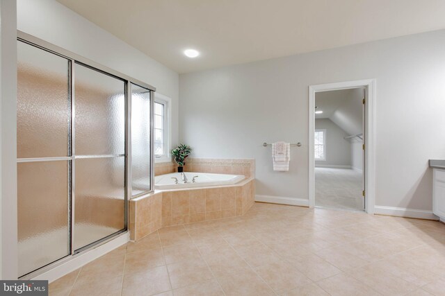 bathroom with a garden tub, a shower stall, tile patterned floors, baseboards, and recessed lighting