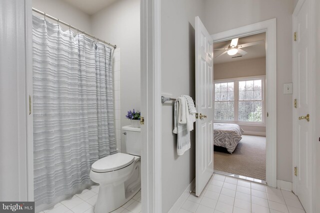 full bathroom featuring tile patterned floors, ceiling fan, baseboards, and toilet