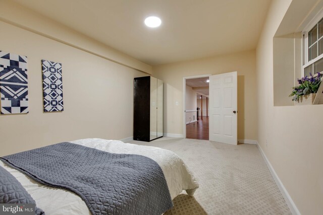 carpeted bedroom with baseboards and recessed lighting