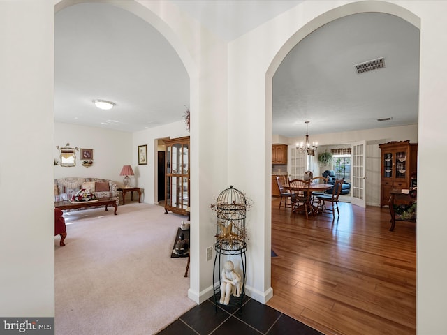 5409 Smith Creek Rd, New Market, VA 22844 - interior space with arched walkways, visible vents, baseboards, and an inviting chandelier