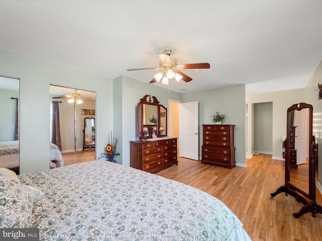 5409 Smith Creek Rd, New Market, VA 22844 - bedroom with multiple closets, light wood finished floors, baseboards, and a ceiling fan
