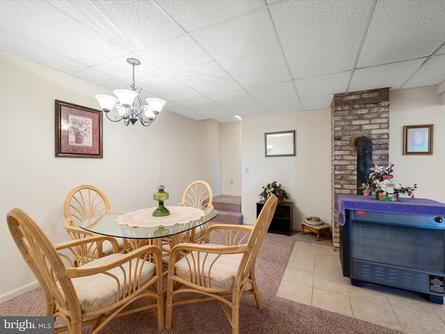 5409 Smith Creek Rd, New Market, VA 22844 - dining space with baseboards, light carpet, a drop ceiling, and an inviting chandelier