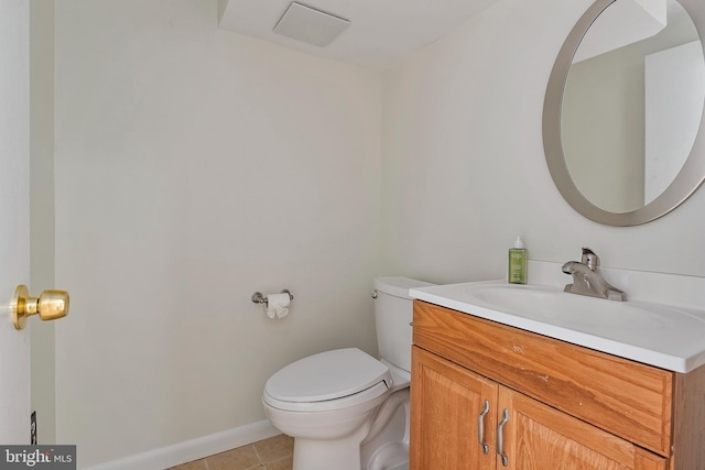 half bathroom featuring baseboards, toilet, tile patterned flooring, and vanity