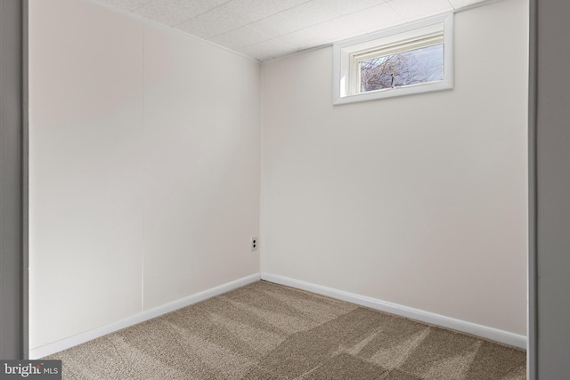 below grade area with carpet flooring and baseboards