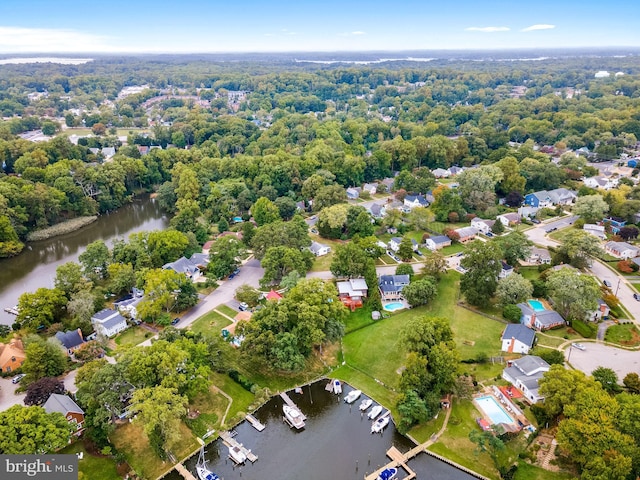 bird's eye view featuring a water view and a residential view