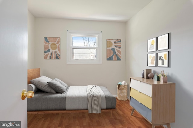 bedroom featuring wood finished floors