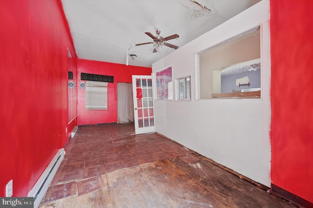 hall featuring a baseboard radiator and parquet floors