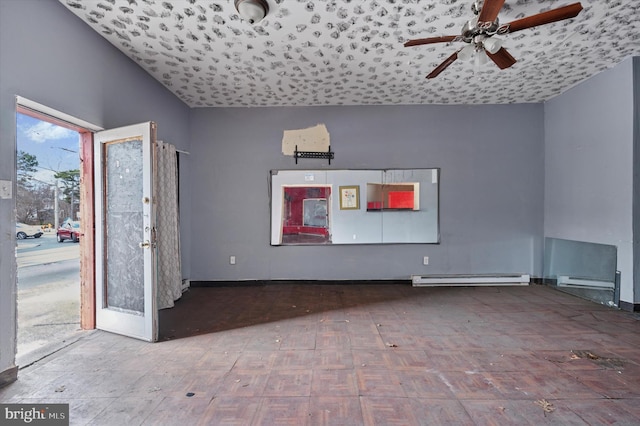 interior space featuring baseboards, a ceiling fan, and a baseboard radiator