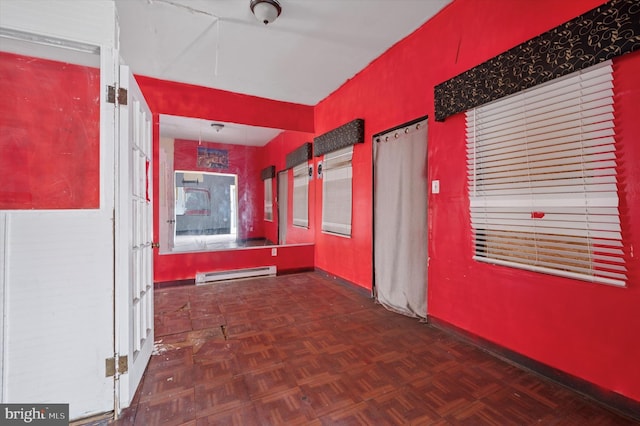 hallway with baseboards and baseboard heating