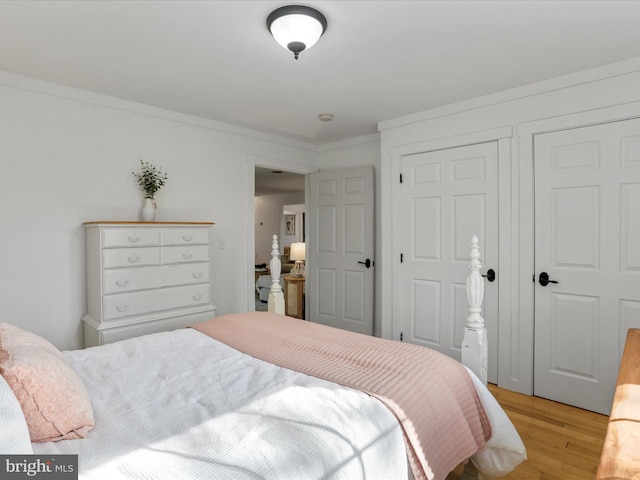 bedroom featuring light wood-style flooring