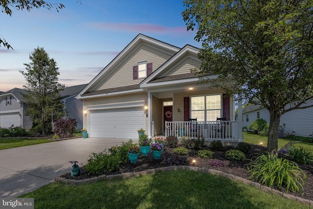 29 Embassy, Woolwich Twp, NJ 08085 - traditional-style house with a porch, concrete driveway, a garage, and a front yard