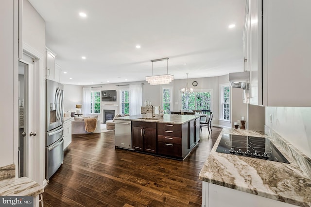 630 Good Shepherd Way, Owings, MD 20736 - kitchen featuring a sink, open floor plan, dark brown cabinetry, appliances with stainless steel finishes, and dark wood-type flooring