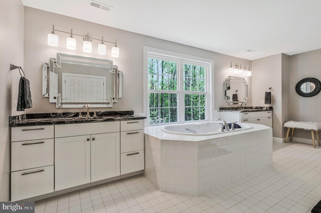 630 Good Shepherd Way, Owings, MD 20736 - full bath with two vanities, a bath, visible vents, and tile patterned floors