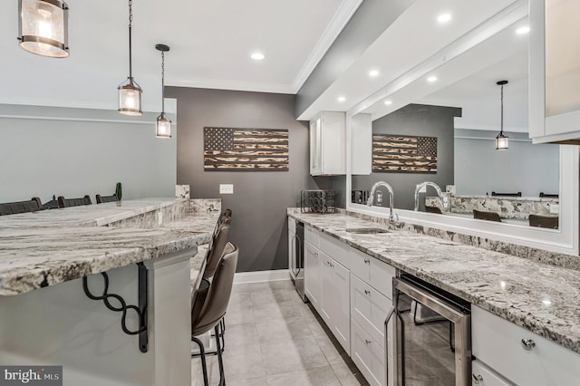 630 Good Shepherd Way, Owings, MD 20736 - kitchen with white cabinets, beverage cooler, a sink, and recessed lighting