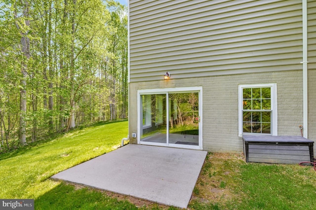 630 Good Shepherd Way, Owings, MD 20736 - exterior space featuring brick siding, a yard, and a patio area