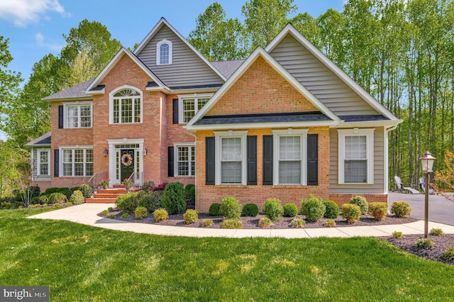 630 Good Shepherd Way, Owings, MD 20736 - colonial home with brick siding and a front yard