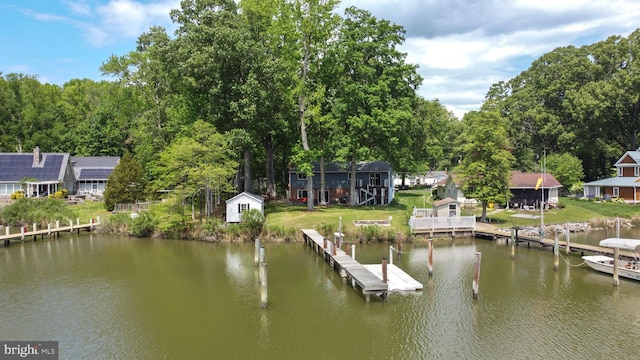 dock with a water view and a lawn