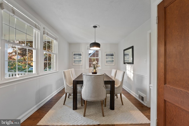 9301 Mintwood St, Silver Spring, MD 20901 - dining area with visible vents, dark wood-style flooring, and a healthy amount of sunlight