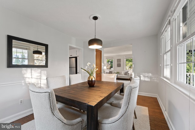 9301 Mintwood St, Silver Spring, MD 20901 - dining area with baseboards, a wealth of natural light, and wood finished floors