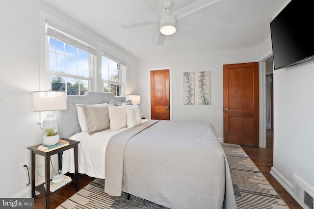 9301 Mintwood St, Silver Spring, MD 20901 - bedroom featuring dark wood-style flooring, baseboards, visible vents, and ceiling fan