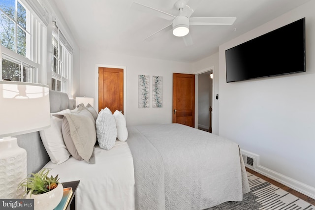 9301 Mintwood St, Silver Spring, MD 20901 - bedroom with visible vents, baseboards, ceiling fan, and wood finished floors