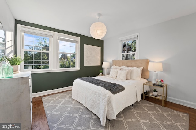 9301 Mintwood St, Silver Spring, MD 20901 - bedroom featuring baseboards, multiple windows, and wood finished floors