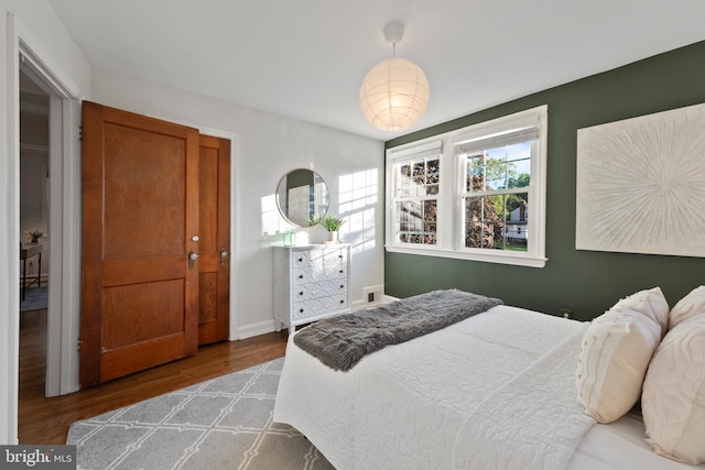 9301 Mintwood St, Silver Spring, MD 20901 - bedroom with visible vents and wood finished floors