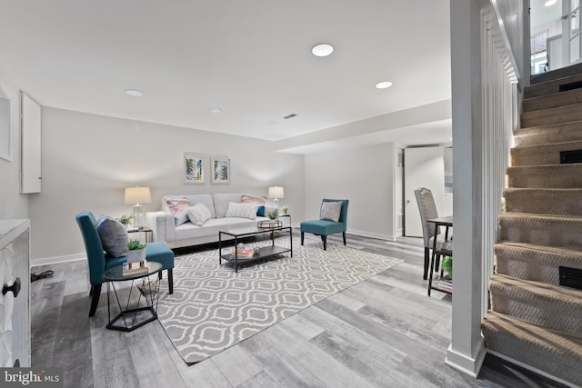 9301 Mintwood St, Silver Spring, MD 20901 - living room with baseboards, recessed lighting, stairs, and wood finished floors