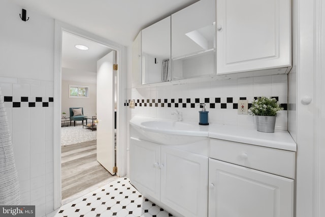 9301 Mintwood St, Silver Spring, MD 20901 - bathroom with tile walls and vanity