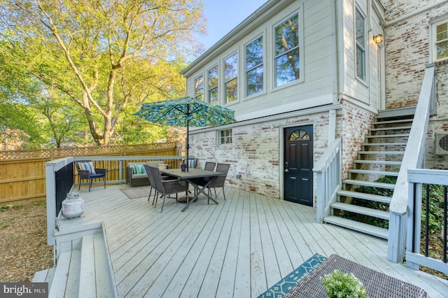 9301 Mintwood St, Silver Spring, MD 20901 - wooden deck featuring stairway and outdoor dining space