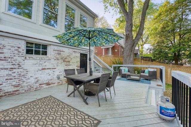 9301 Mintwood St, Silver Spring, MD 20901 - deck with an outdoor living space, outdoor dining area, and fence
