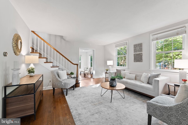 9301 Mintwood St, Silver Spring, MD 20901 - living room with baseboards, dark wood finished floors, and stairway